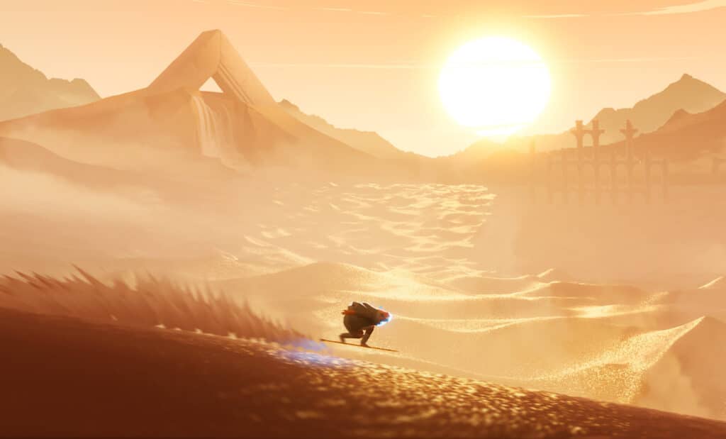 ソード・オブ・ザ・シーでは、夕暮れ時に黄金の砂丘を一人のライダーが滑走し、ゲームの広大な砂漠の風景を際立たせている。