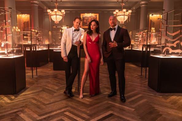 The official Netflix Red Notice trailer is here, combining Dwayne Johnson, Gal Gadot, and Ryan Reynolds in an action heist movie.