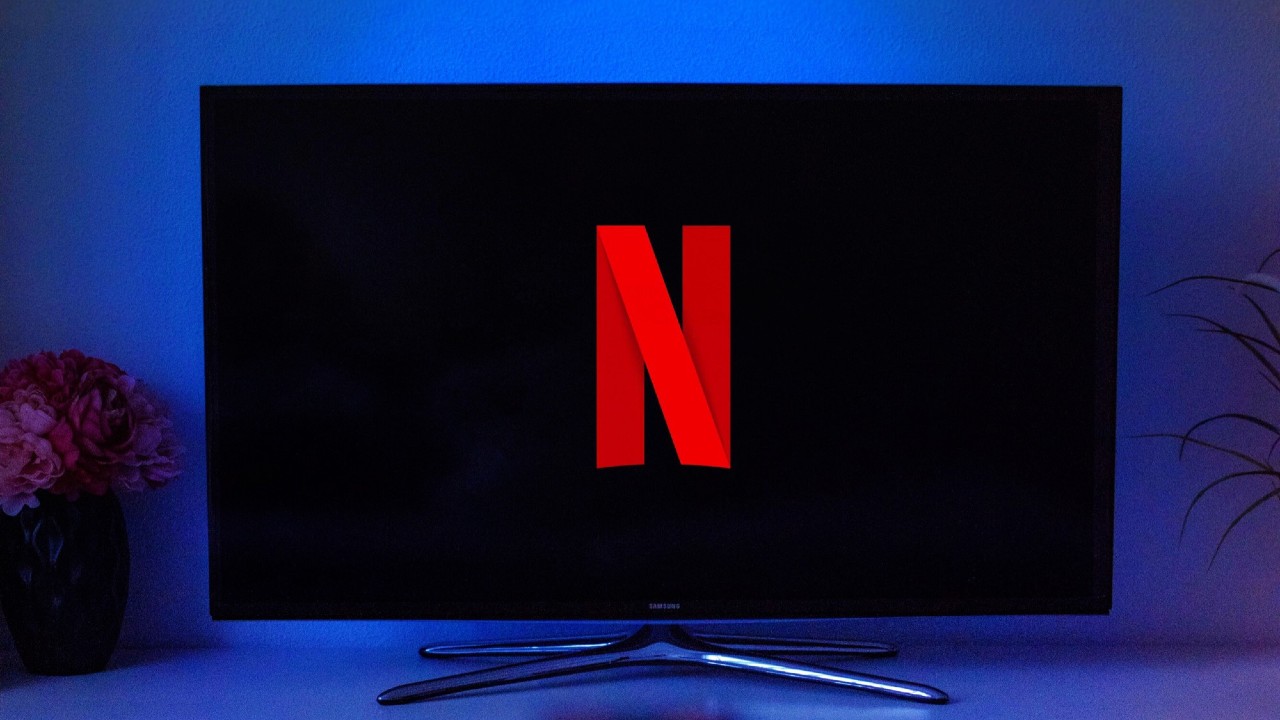 Netflix logo displayed on TV screen. The password sharing crackdown is paying dividends for Netflix.