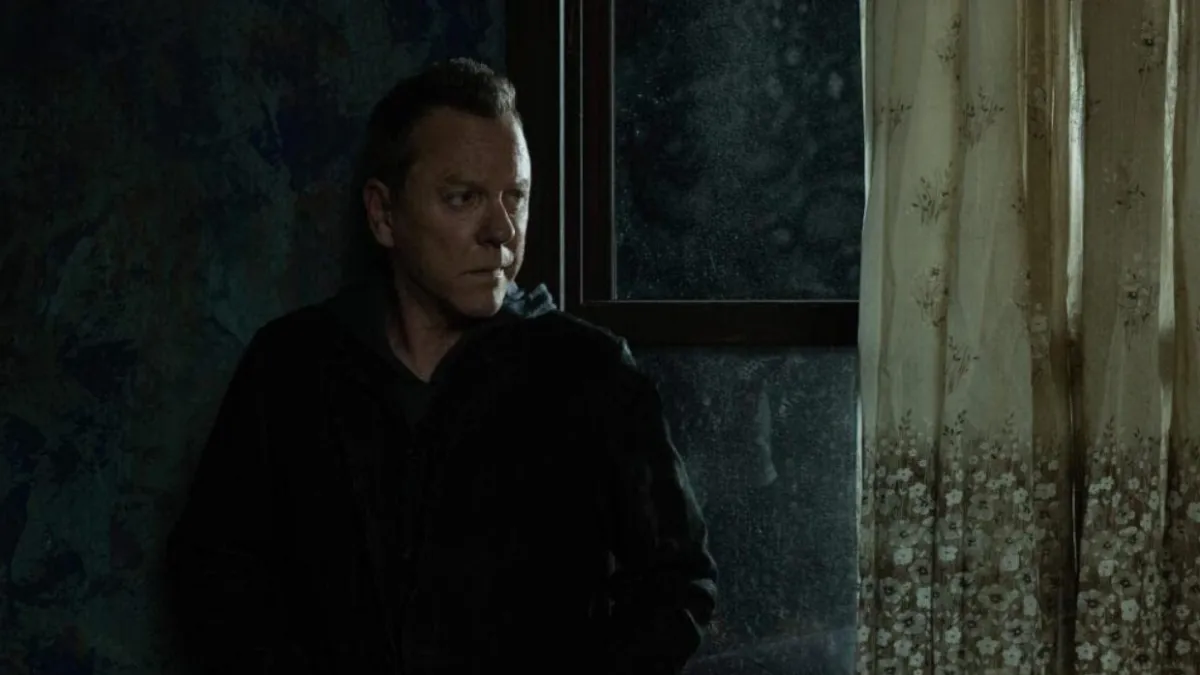 Where to Watch The Rabbit Hole TV Series - Kiefer Sutherland as John Weir in a Dark Room
