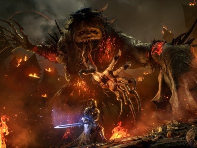 Knight fighting a massive creature in a burning village in Lords of the Fallen.