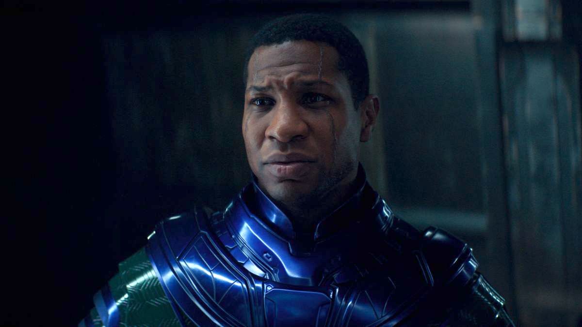 Jonathan Majors as Kang the Conqueror in Ant-Man and the Wasp: Quantumania looks off to the left. He is wearing his purple armor.