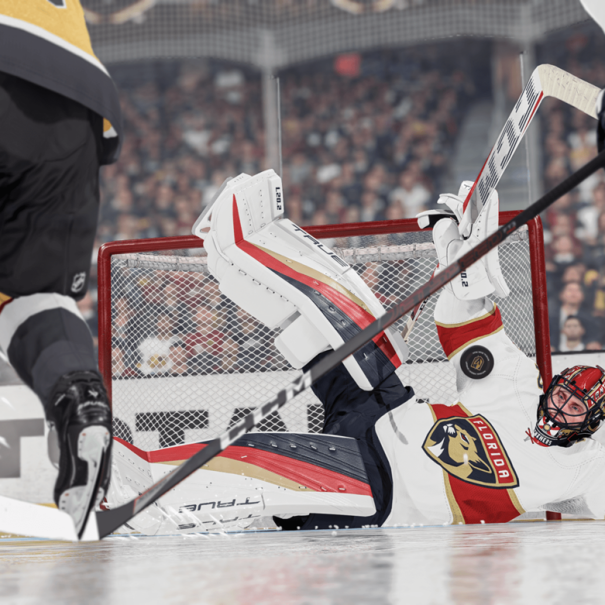 An image of a goalie for the Florida Panthers blocking a shot while down on the ice as part of an article on NHL 24 that predicts the results of the Stanley Cup.