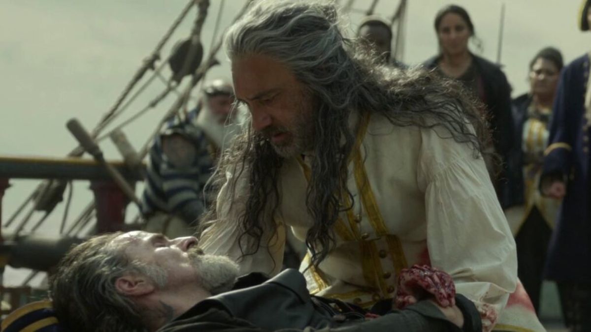 Characters embracing in Our Flag Means Death. This image is part of an article about how Our Flag Means Death's cancellation is the latest in a long line of streaming tragedies. 