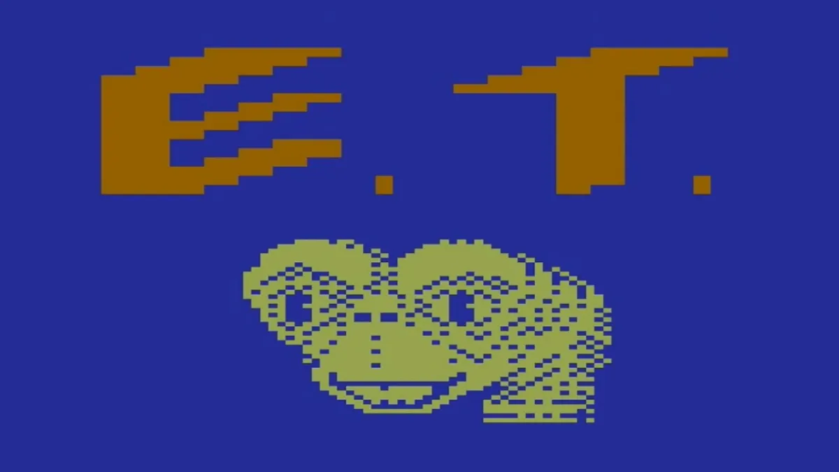 The title screen of E.T.: The Extra-Terrestrial showing the titular character against a blue background with his initials above him as part of a ranked list of the worst video games ever.