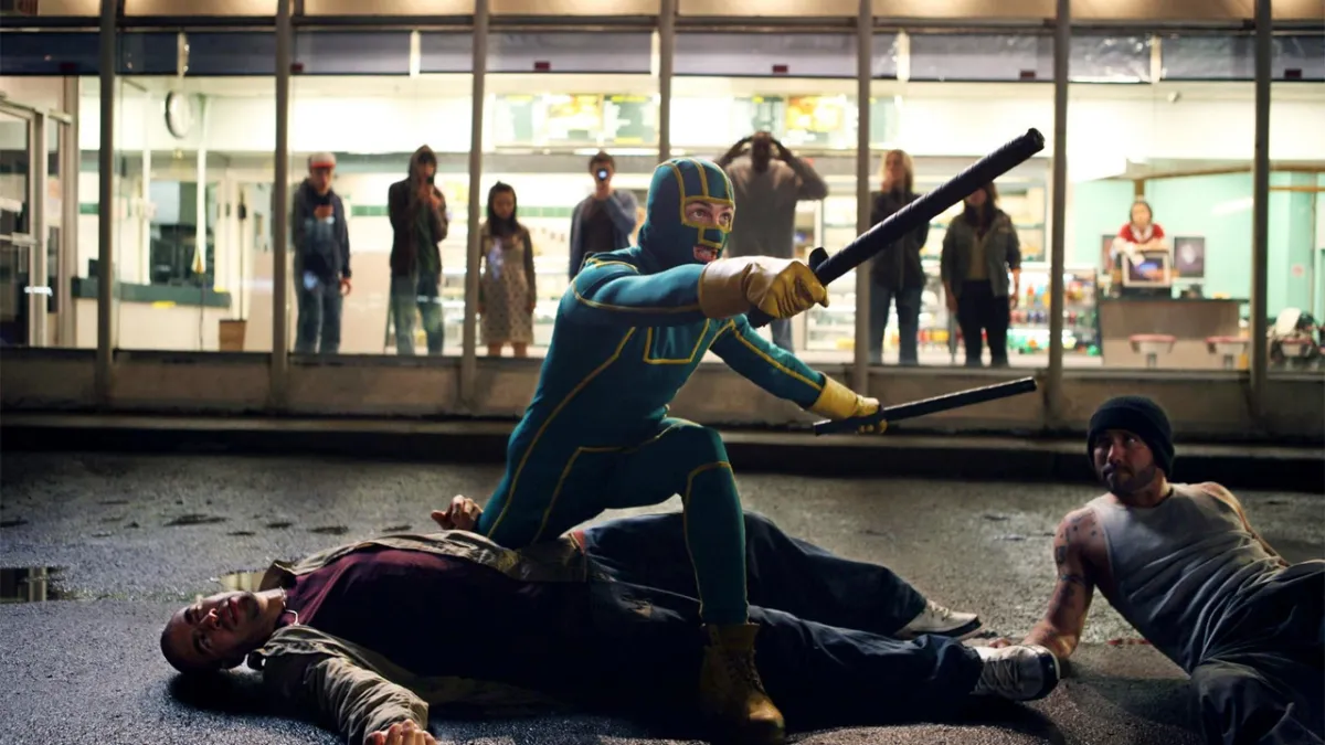 Kick Ass fighting bad guys. This image is part of an article about how Kick-Ass 3 is actually part of a trilogy, connects to the original films.