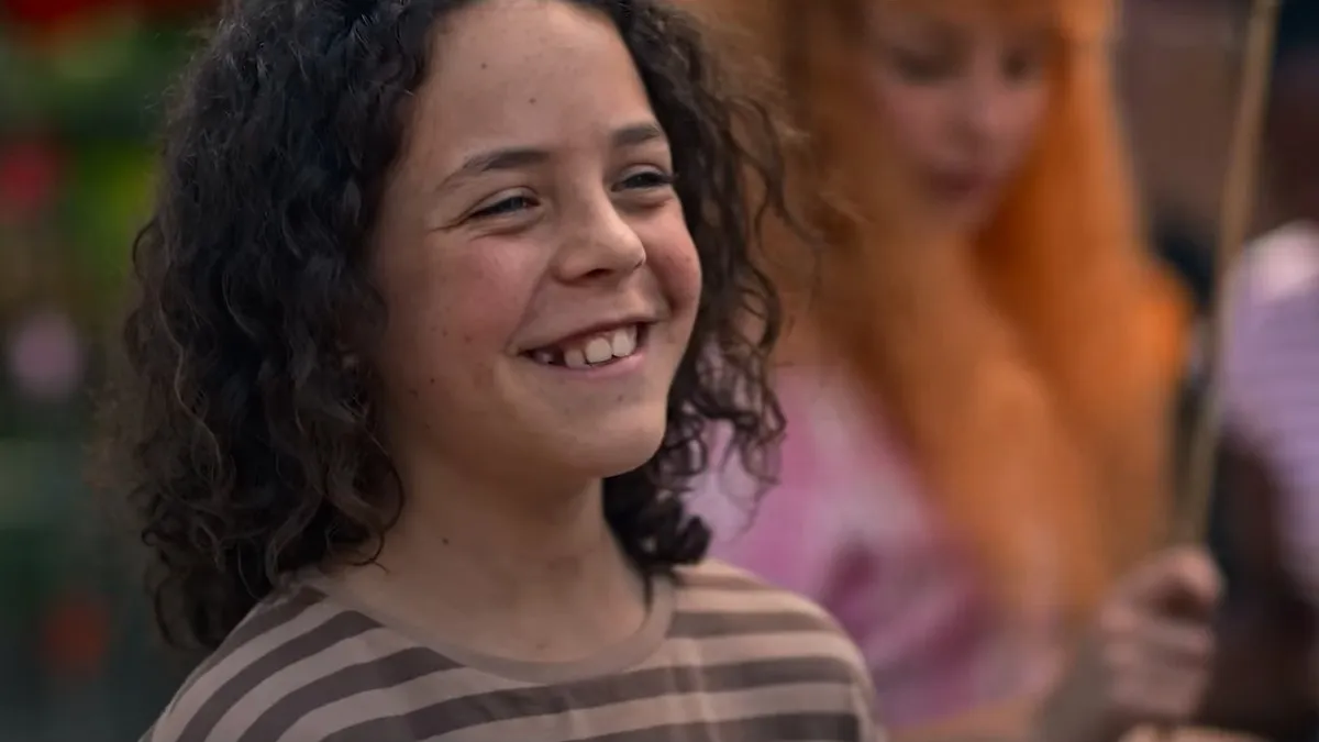 Eli Bell, played by Felix Cameron, smiles in a still from Boy Swallows Universe on Netflix.