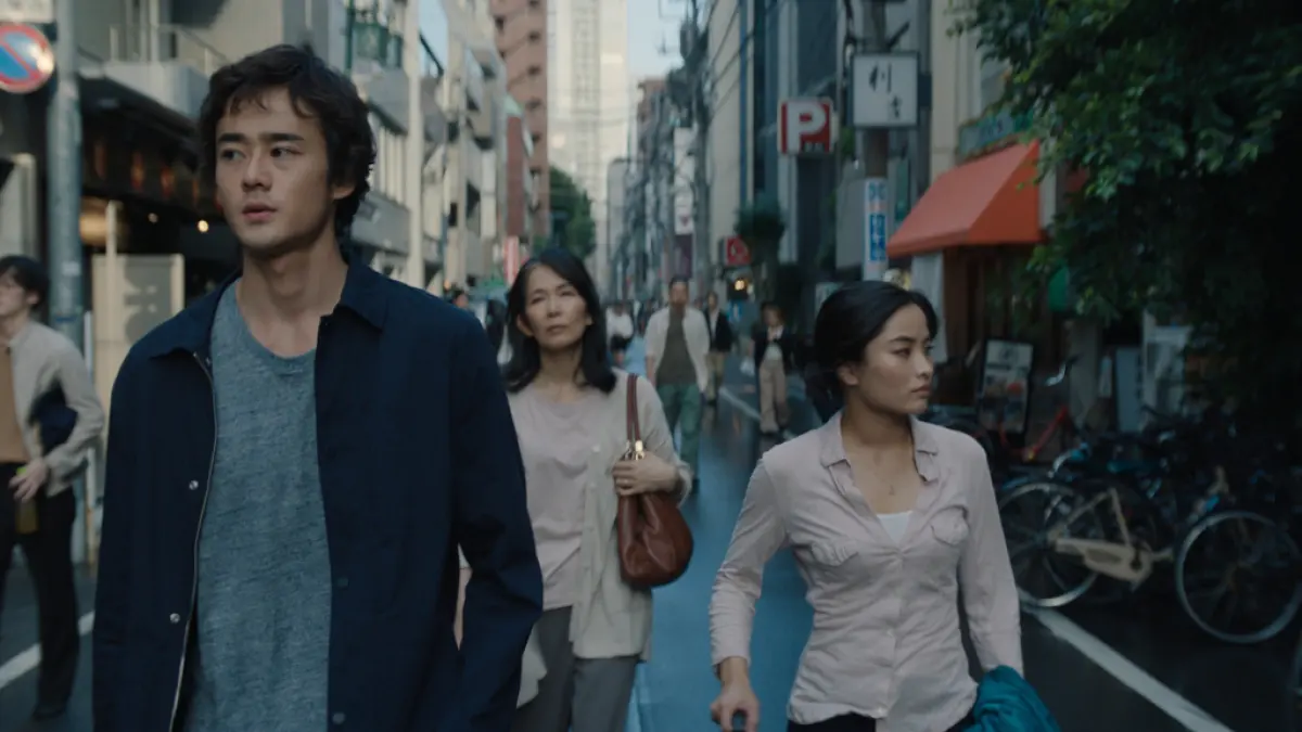 Kentaro and Cate Randa walk through Tokyo. This image is part of an article about all of the Monarch: Legacy of Monsters filming locations.