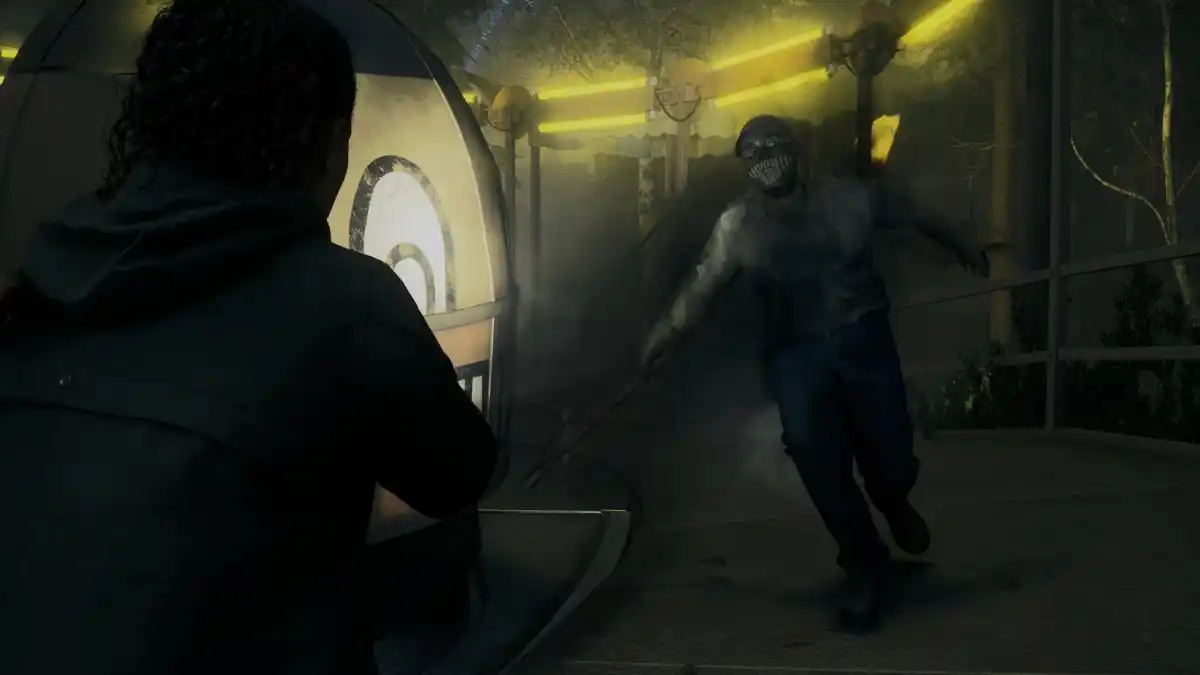 An image from Alan Wake 2 showing a creature rushing at Saga. The image is part of an article explaining the story of Alan Wake 2.