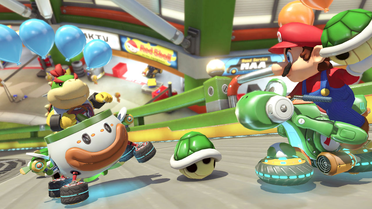 Mario Kart 8 Deluxe with two racers throwing shells at each other.