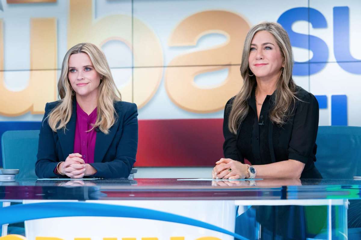 Two news anchors sitting together. This image is part of an article about the best TV dramas in 2023.