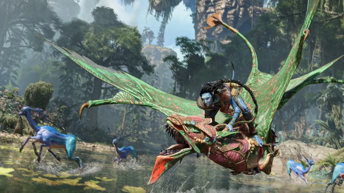 Image of blue-skinned male riding a green flying beast near a river in Avatar: Frontiers of Pandora.