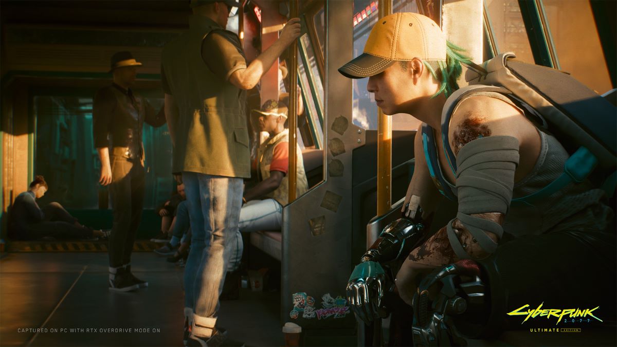 A woman sits on a Metro train in a still from Cyberpunk 2077.