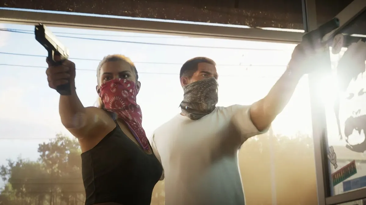 The two protagonists of GTA 6 holding weapons against a sun-drenched backdrop. This image is part of an article about which consoles GTA 6 will be on.