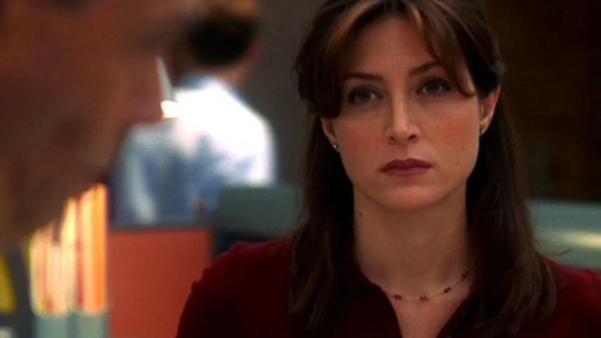 Kate looking angry in NCIS. This image is part of an article about why Kate actor Sasha Alexander left NCIS.