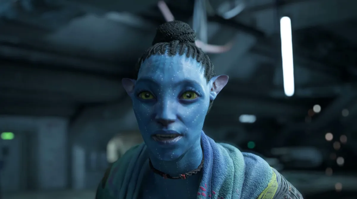 A blue Na'vi woman with a topknot in Avatar: Frontiers of Pandora.