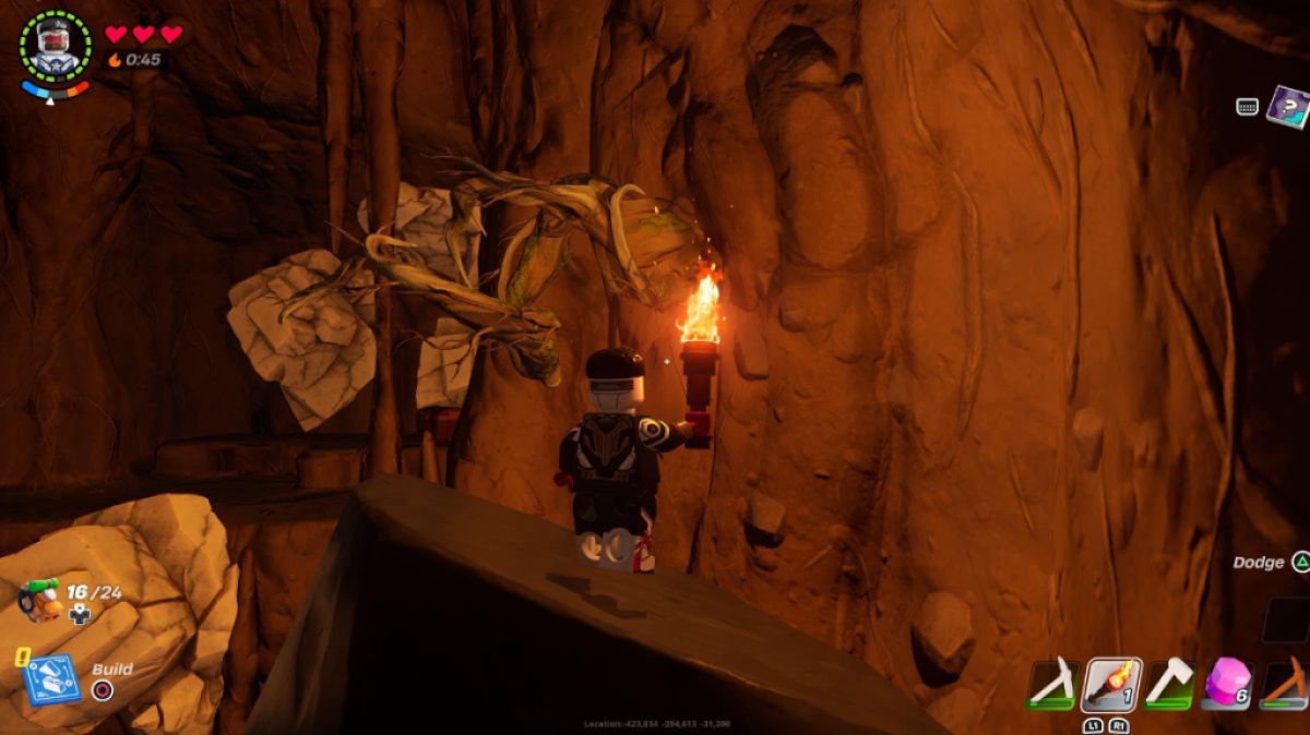 Knotroot Wood in a cave in LEGO Fortnite as part of an article on how to find the material.