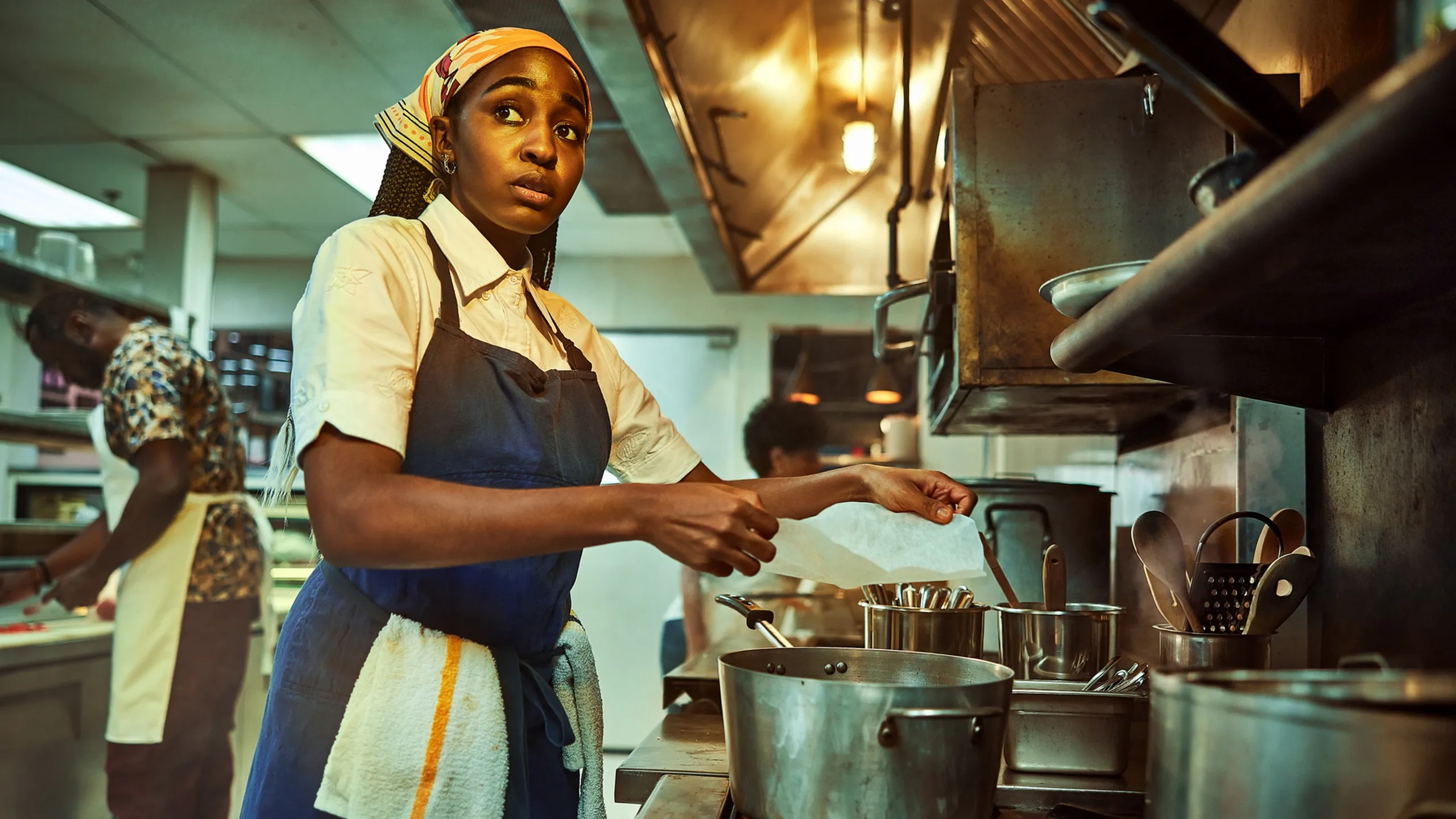 Sydney works in the kitchen in The Bear. This image is part of an article about the best TV dramas in 2023.