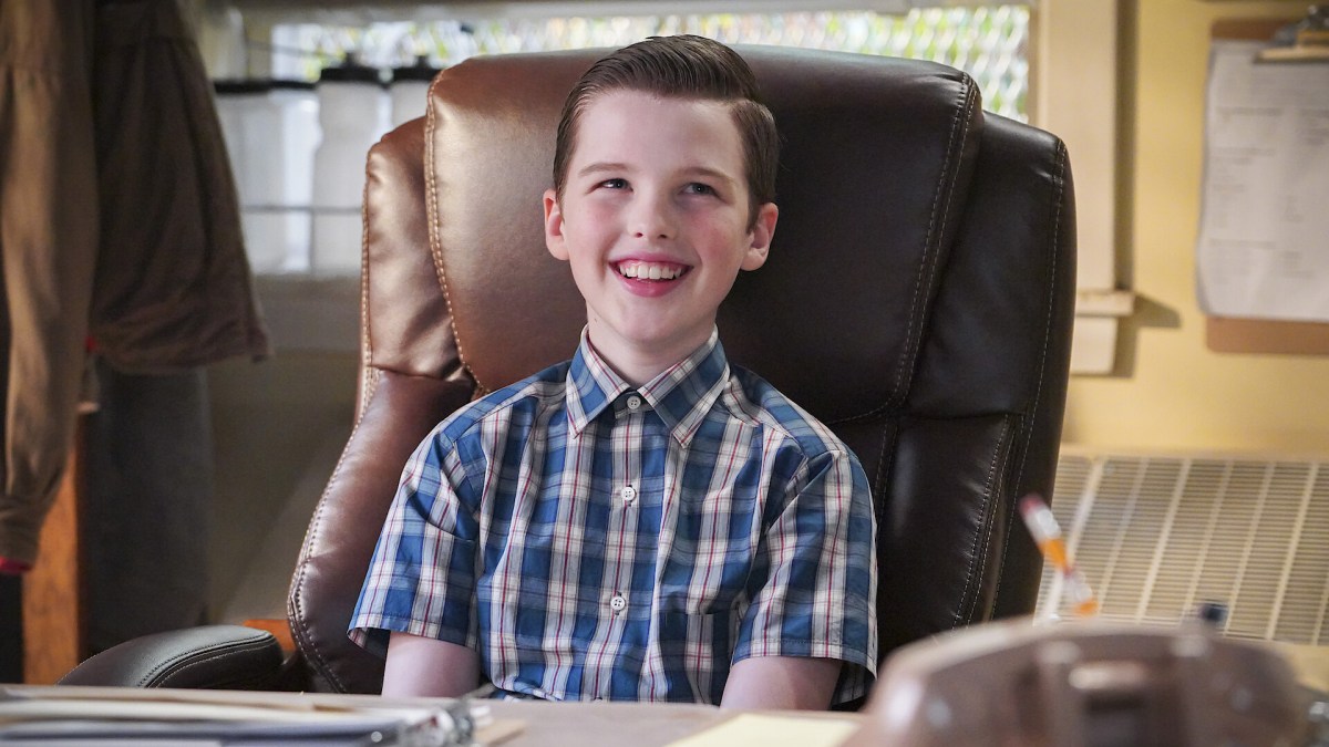An image of Young Sheldon sitting at a desk in a leather chair. The image is part of an article on if Young Sheldon is getting a skin in Fortnite.