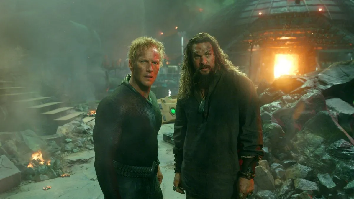 Orm and Arthur stand amid rubble