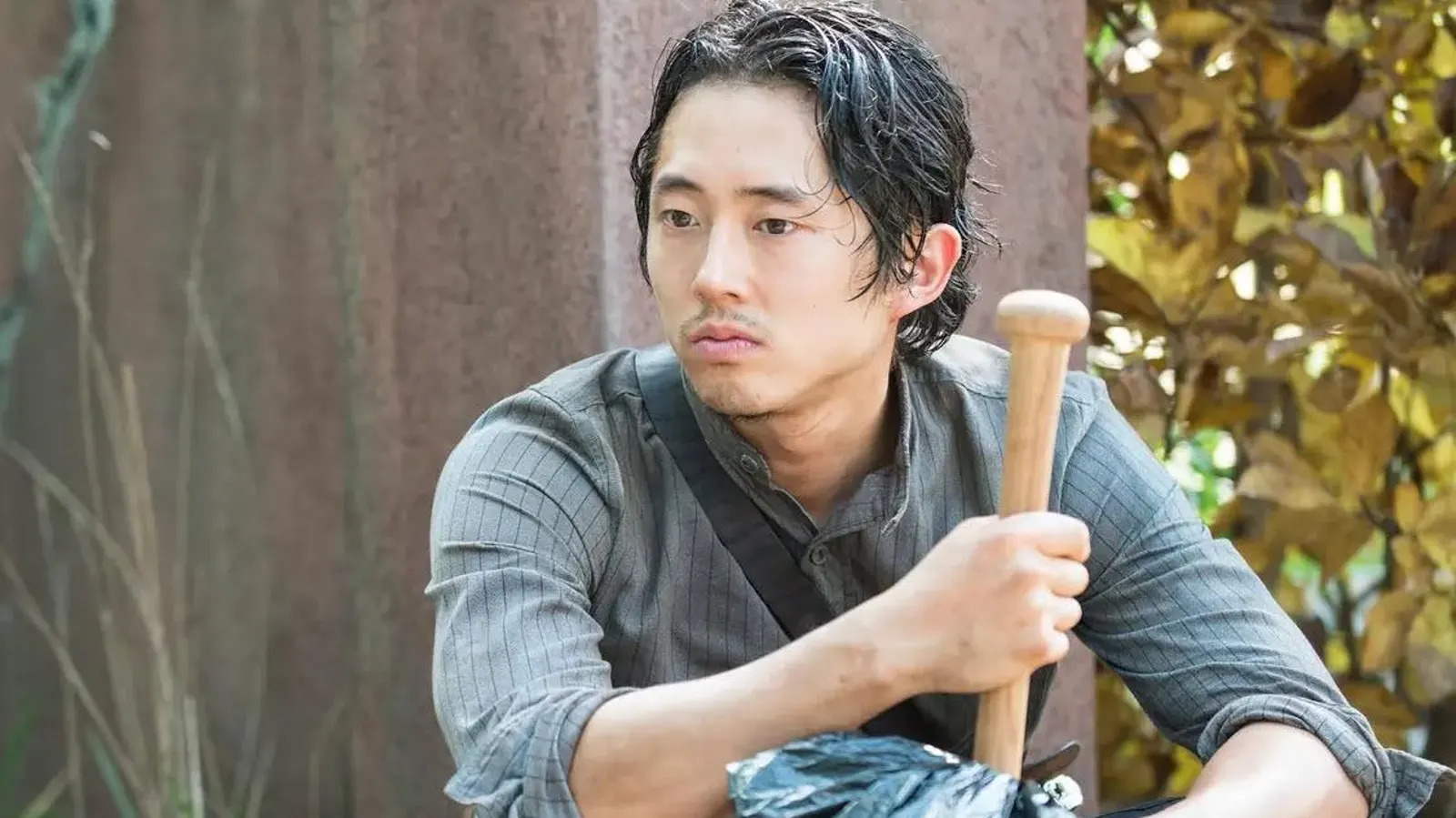 Steven Yeun in The Walking Dead. This image is part of an article about Steven Yeun still wanting to do a Marvel movie despite leaving Thunderbolts.