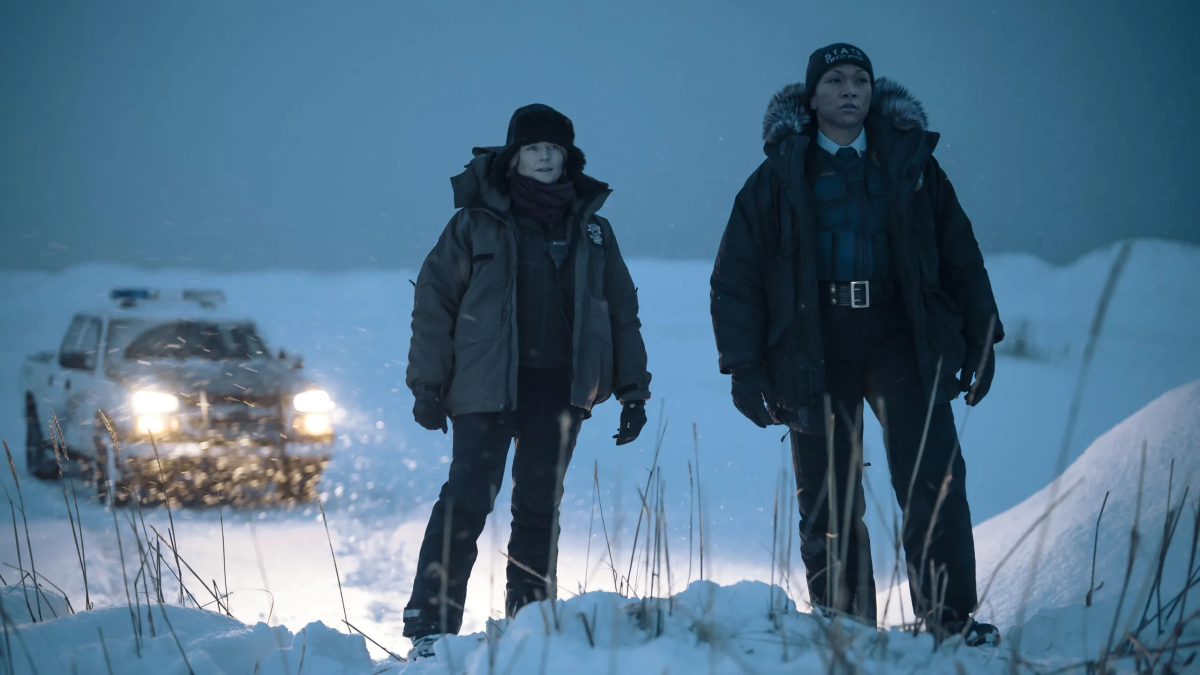 Two characters in the snow in True Detective Season 4. This image is part of an article about all four seasons of True Detective, ranked from worst to best. 