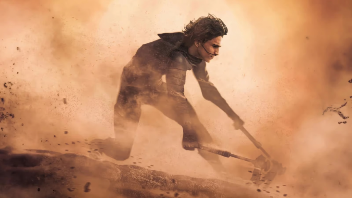 Paul Atreides riding a sandworm in Dune: Part Two. This image is part of an article about how Dune 2 finally pulls off what the Star Wars prequels set out to do.