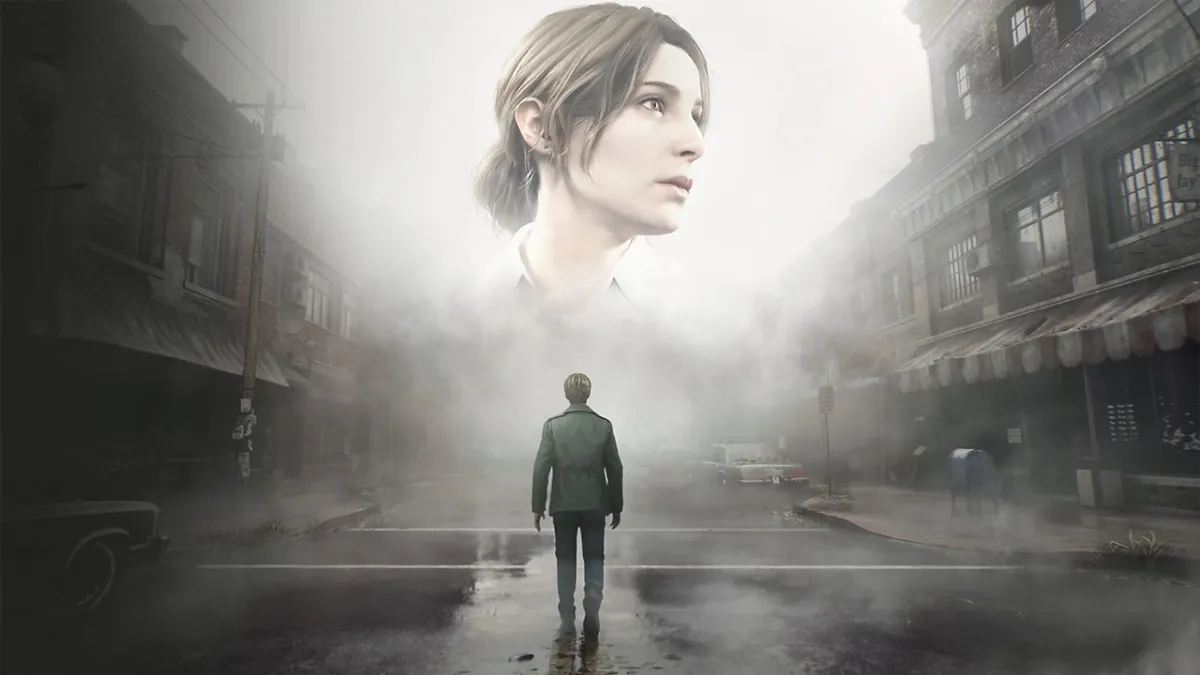 An image of the Silent Hill 2 remake, with a man in a green jacket standing in a town looking at a ghostly image of a giant woman's head.