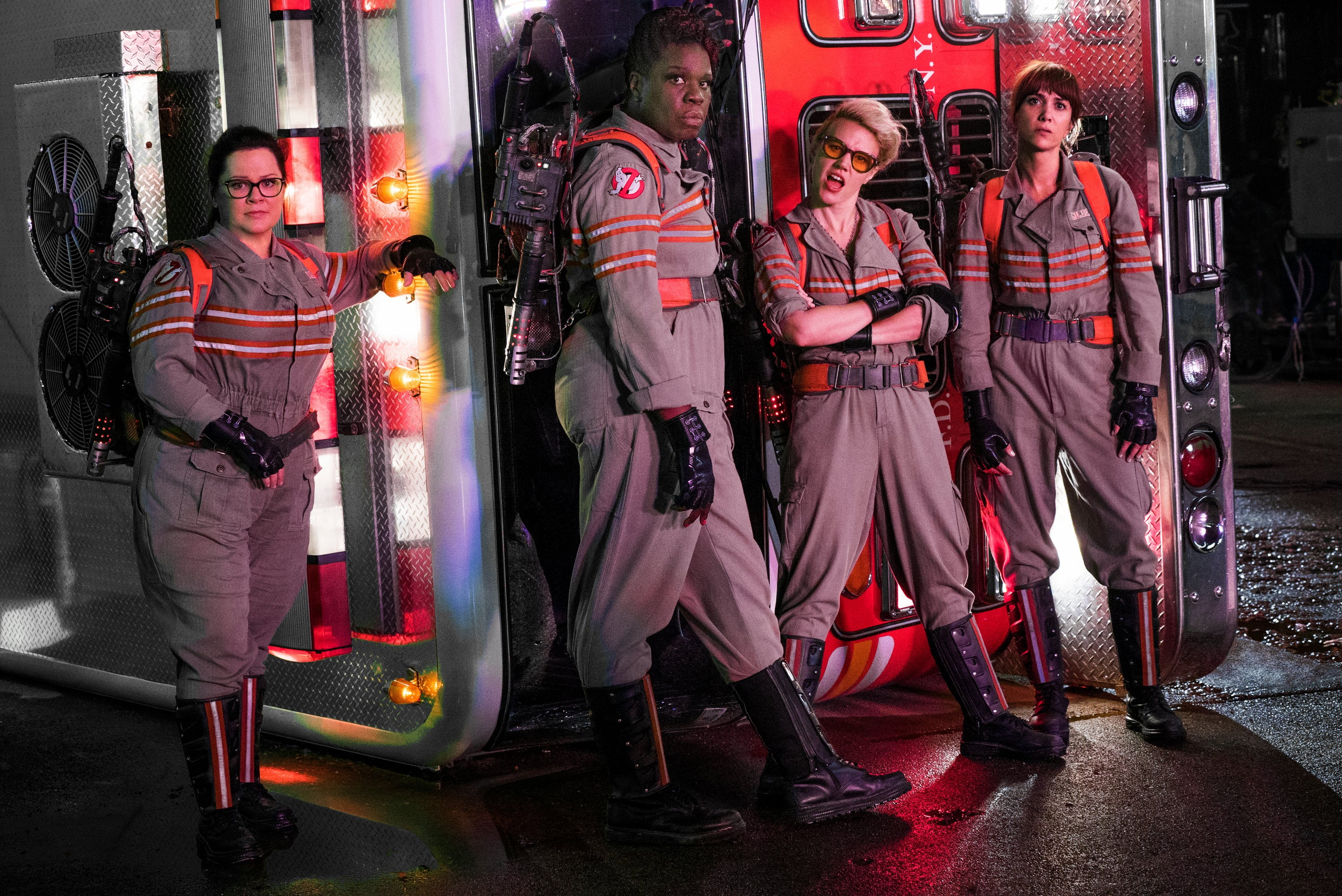 The all-new Ghostbusters pose in uniform