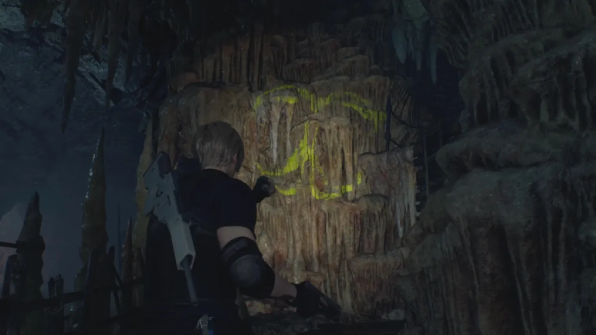 Leon shines a light on a cave puzzle. This image is part of an article about how to solve the cave puzzles in Resident Evil 4 remake.