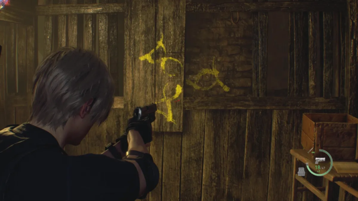 Leon aims at yellow graffiti of three fish. This image is part of an article about how to solve the cave puzzles in Resident Evil 4 remake.