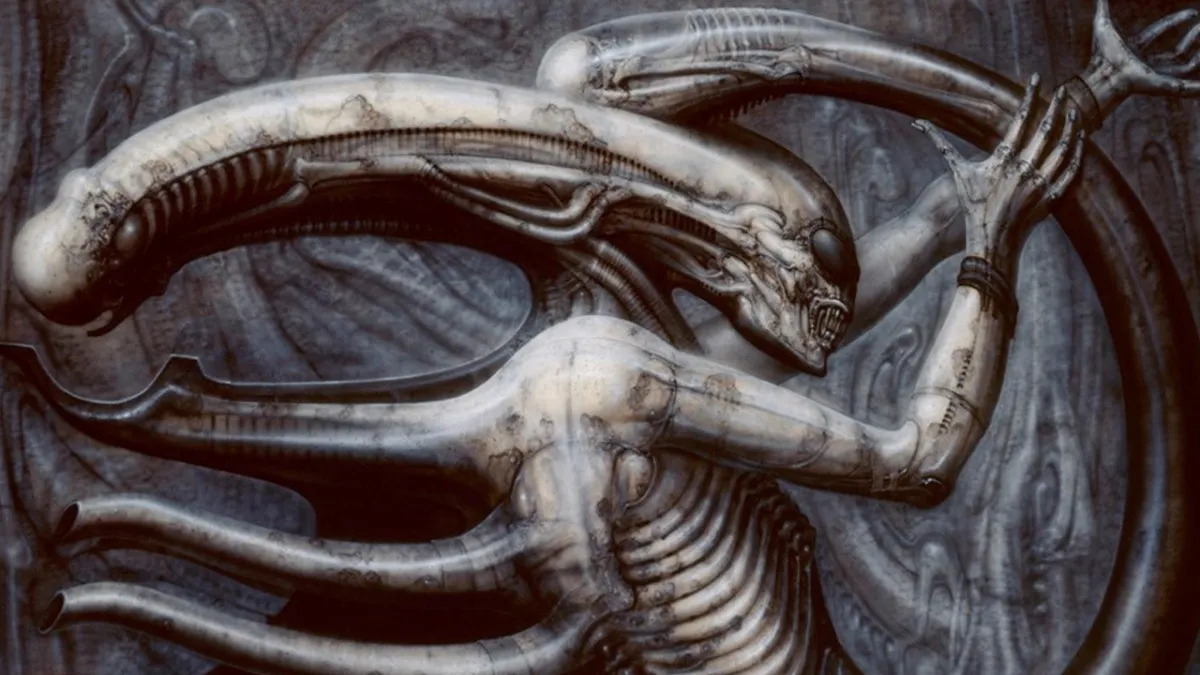 An image of an Alien, designed by HR Giger. It has a long head, protrusions on its back and black circles for eyes.  This image is part of an article about how do Xenomorphs see in the Alien movies.