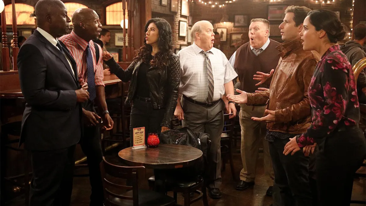 Brooklyn Ninety-Nine's characters standing around in a bar. 