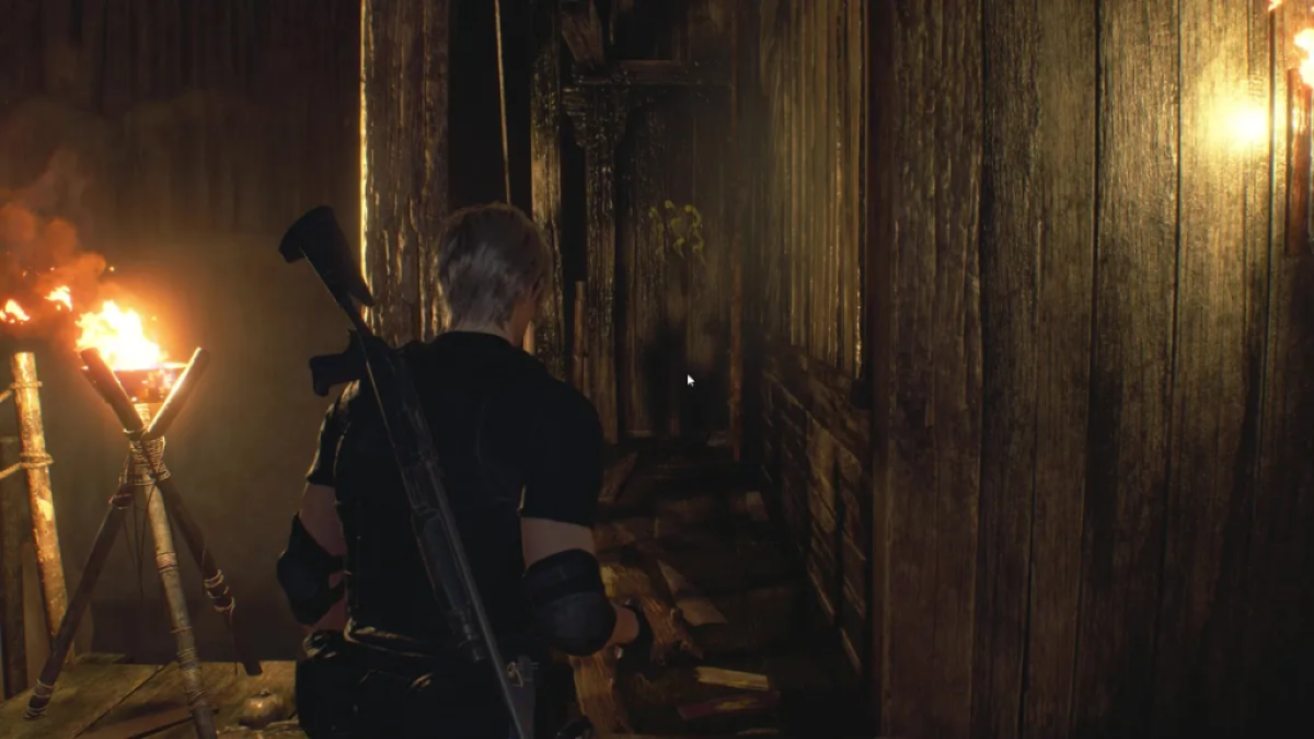 Leon approaches a marked wooden door. This image is part of an article about how to solve the cave puzzles in Resident Evil 4 remake.