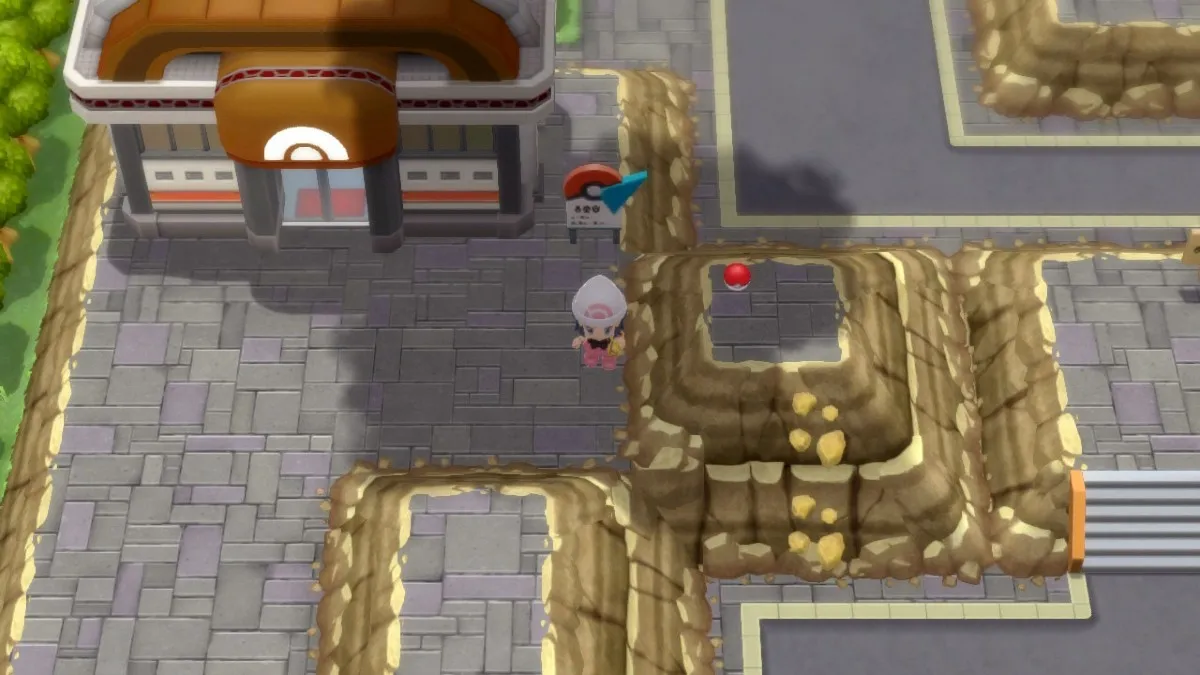 Captura de pantalla de Pokémon Brilliant Diamond, que muestra un avatar parado cerca de un objeto encontrado en el suelo.