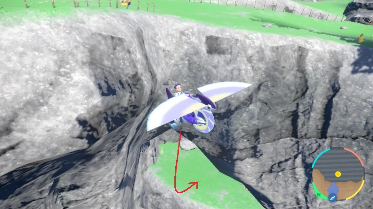 Pokemon Scarlet and Violet screenshot of Miraidon gliding over an alcove in Area Zero with a red arrow pointing to Iron Crown's location