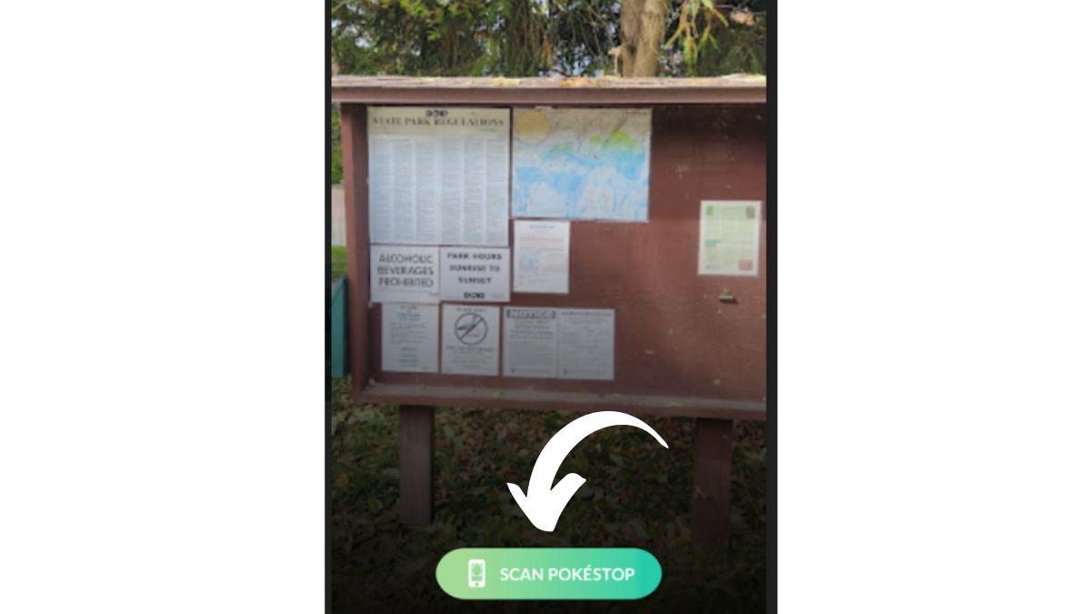 Screenshot of a PokeStop in Pokemon GO with an arrow pointing t othe "scan pokestop" button