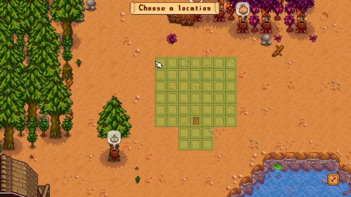 Screenshot of a Stardew Valley farm showing a set of green tiles where the greenhouse will be moved