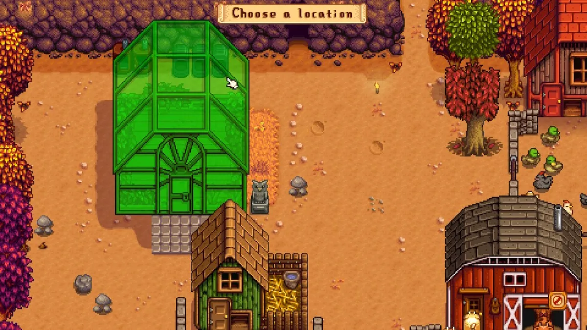 Screenshot of Stardew Valley farm in the "move buildings" setting, with a cursor selecting the greenhouse