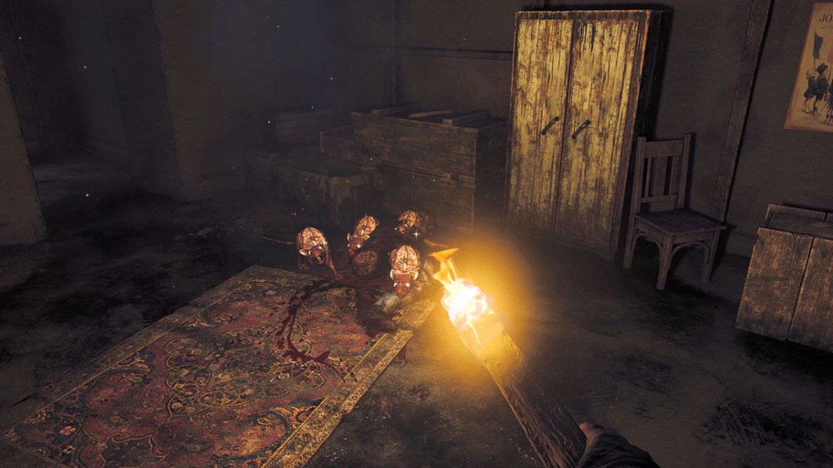 Amnesia: The Bunker, the player holding a lit stick in front of a group of rats in a bunker.