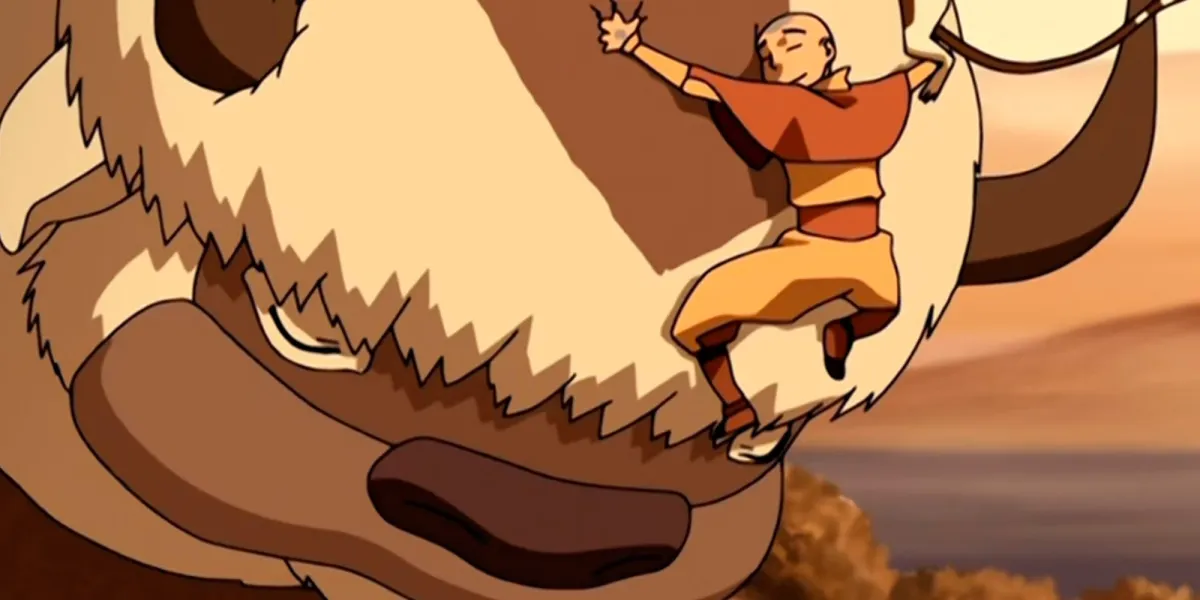 Aang hugging Appa in Avatar: The Last Airbender.