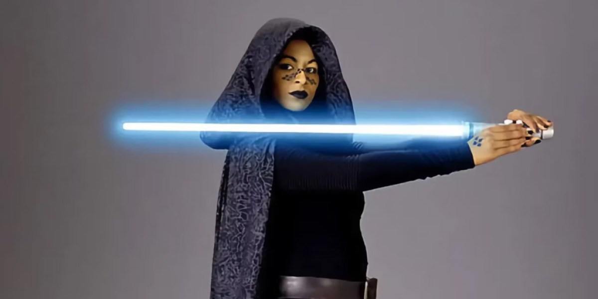 Barriss Offee holding a lightsaber in Attack of the Clones. This image is part of an article about why Barriss Offee is in jail in Star Wars: Tales of the Empire.