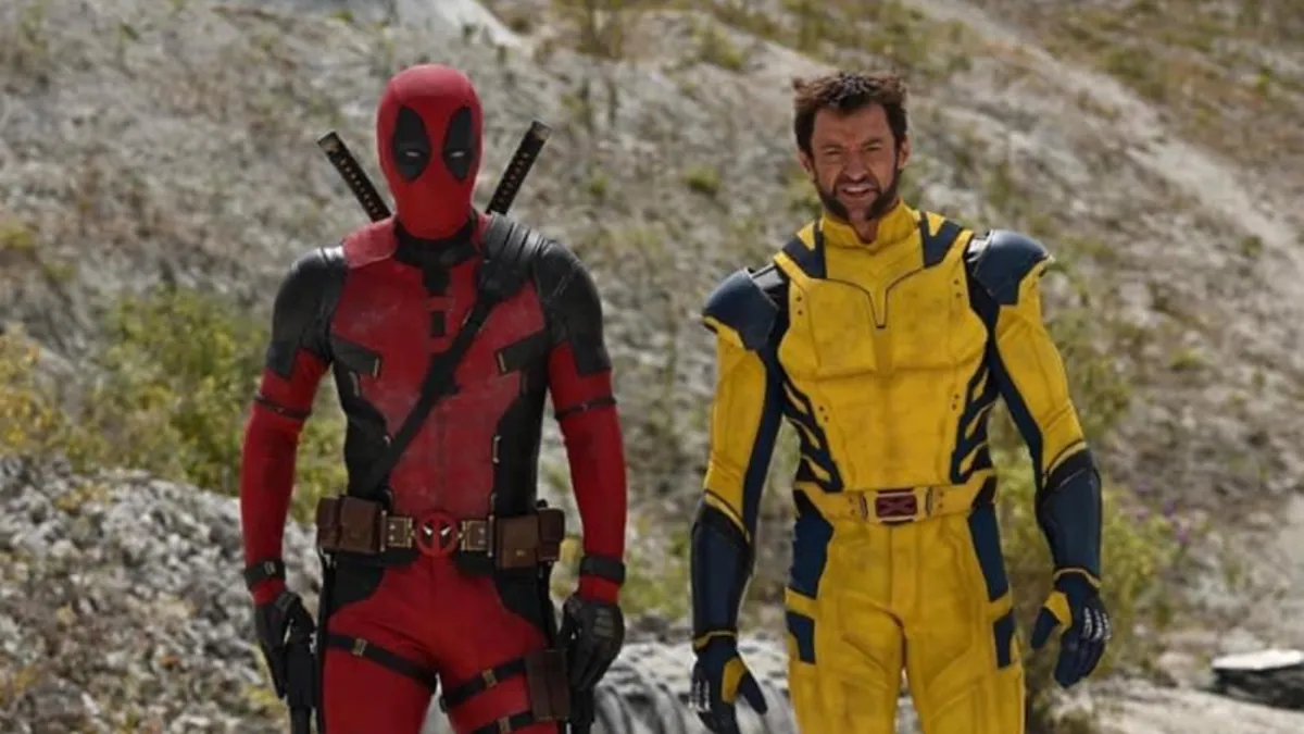 Deadpool & Wolverine, Deadpool and Wolverine, in his yellow costume, walking side by side.