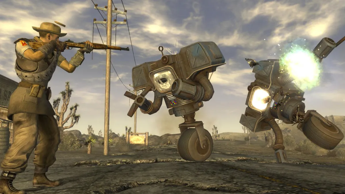 Fallout: New Vegas, with an armed character shooting at two one-wheeled robots.
