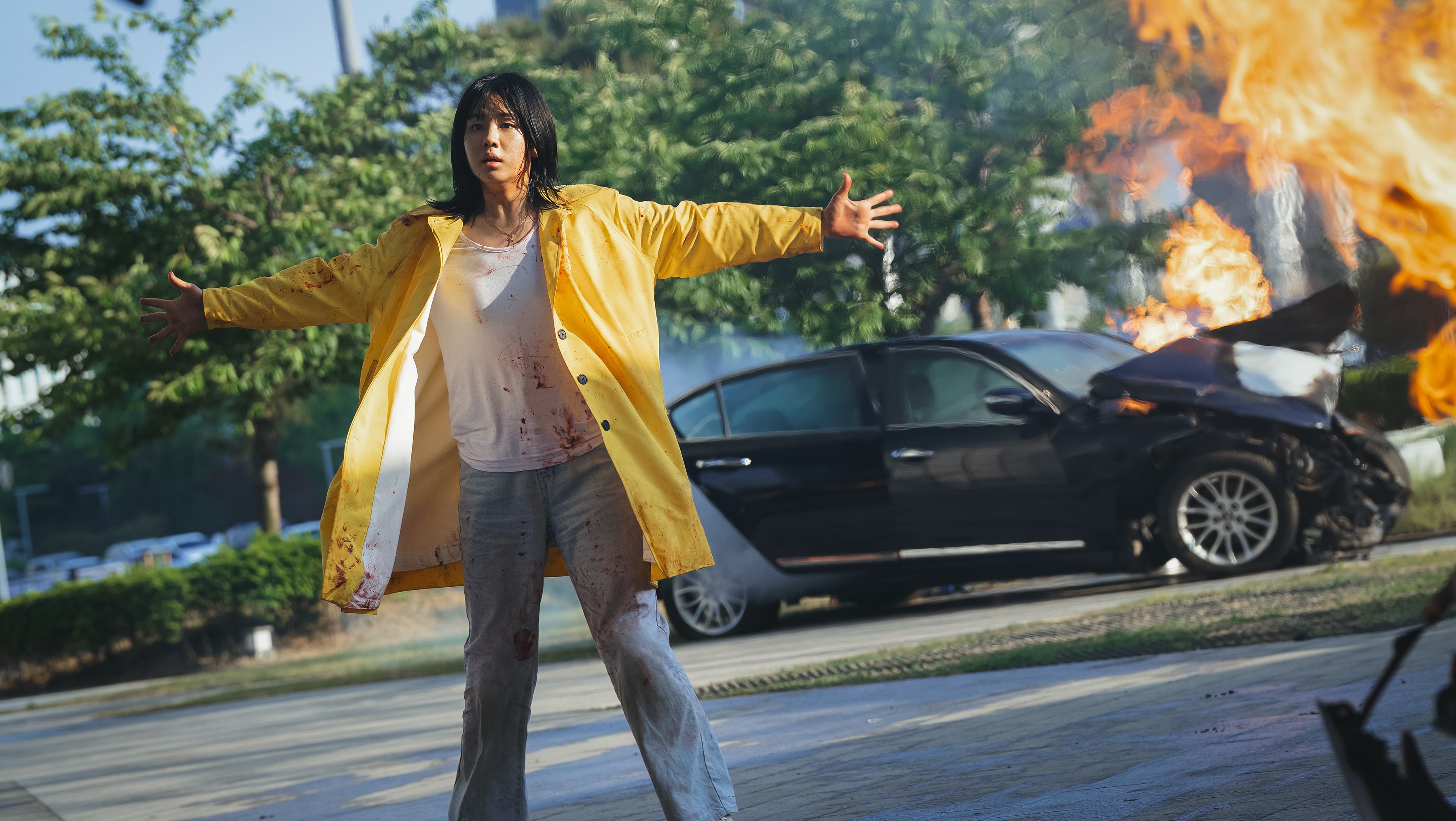 A car explodes in Goodbye Earth. This image is part of an article about all the major actors and the cast list for Netflix's Goodbye Earth.