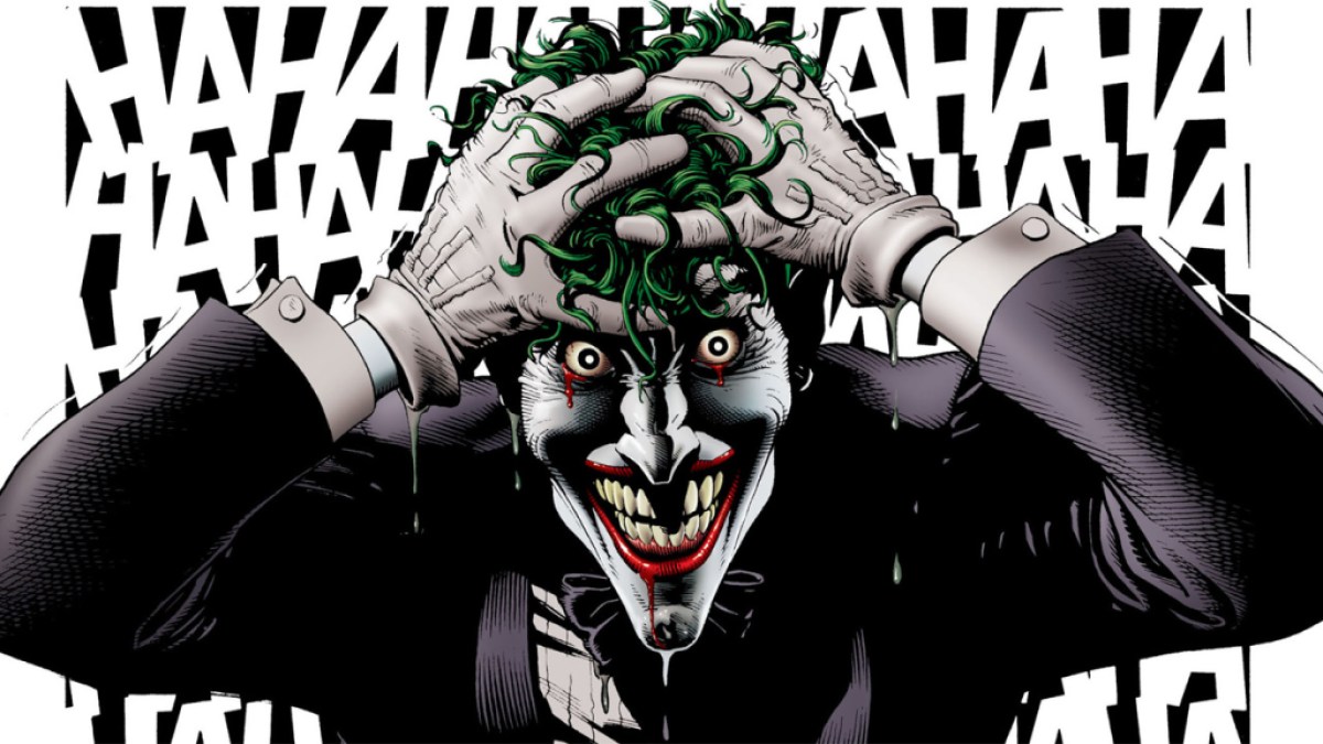 The Joker from Batman, laughing with his head in his hands. This image is part of an article about what is joker's origin in the Batman comics.
