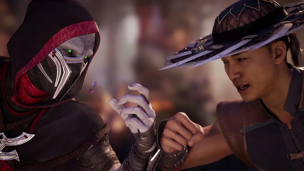 Ermac, a pale ninja, facing off against Kung Lao, a hat-wearing fighting monk, in Mortal Kombat 1