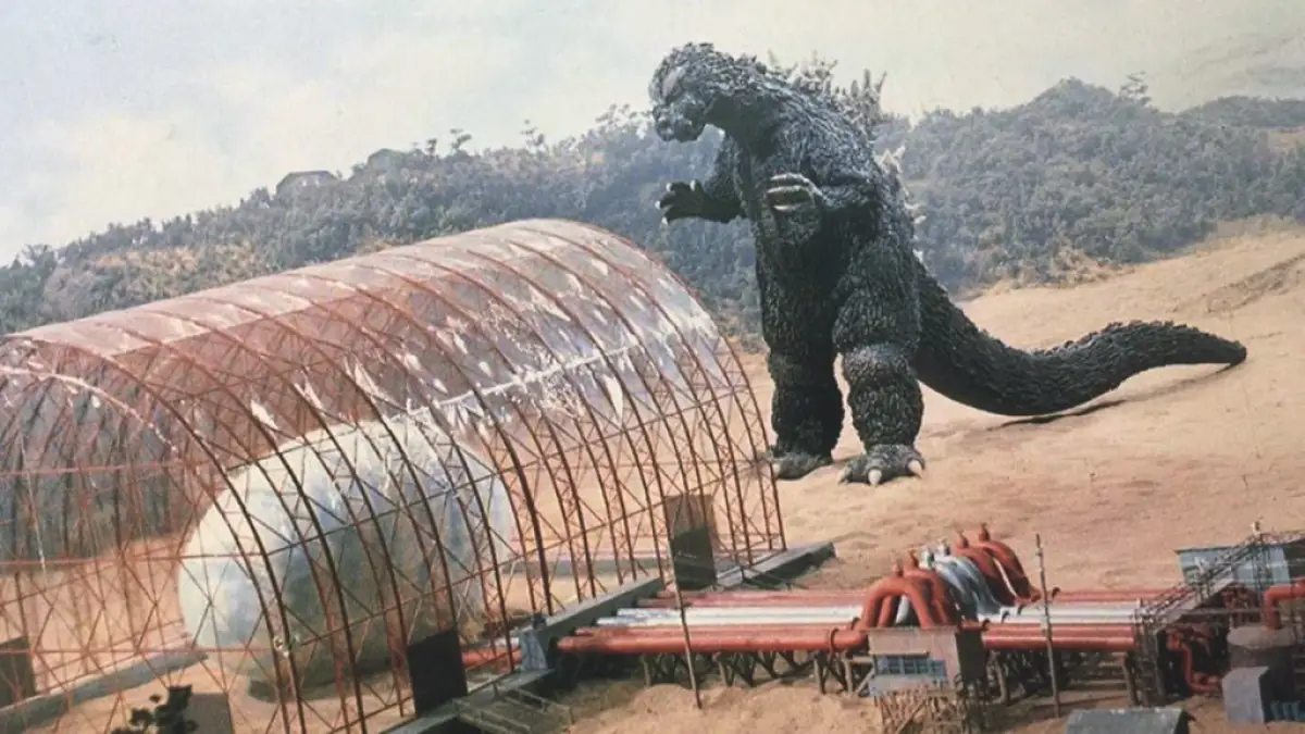 Godzilla approaches Mothra's egg