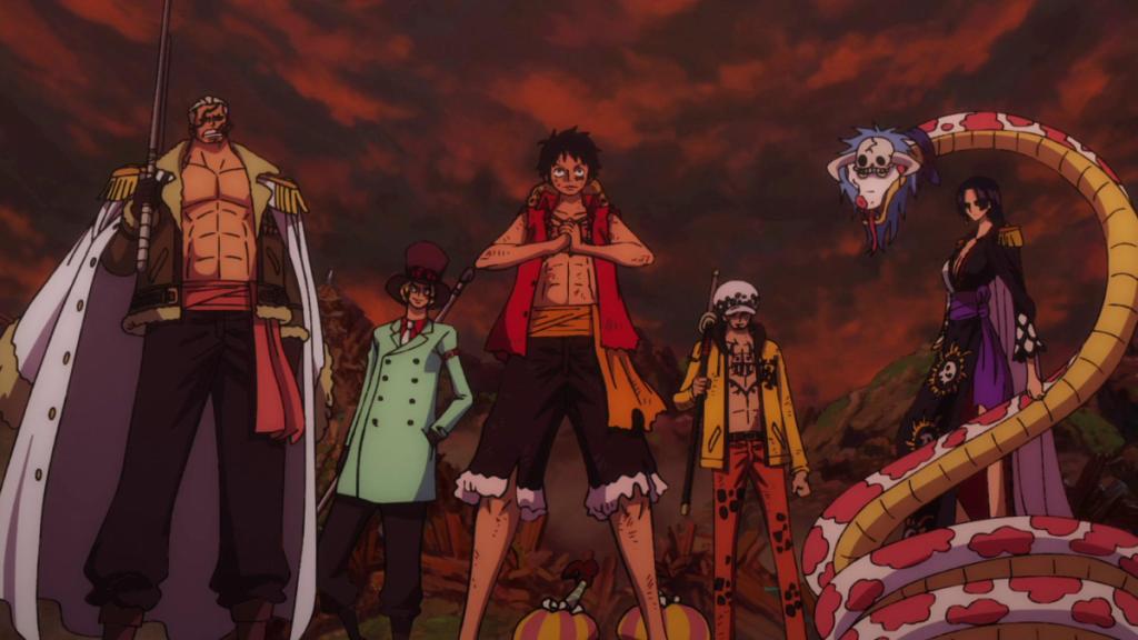 Luffy cracks his knuckles as he leads the pirates.  This image is part of an article about how to watch all One Piece movies in order.