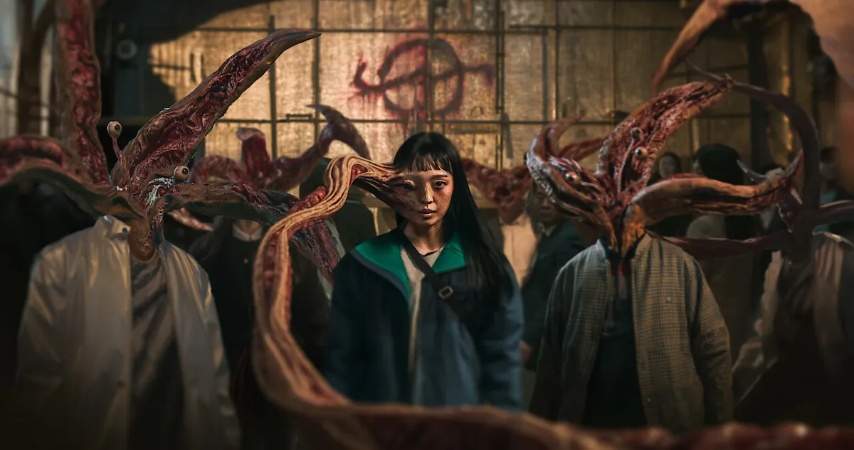 Parasyte: The Grey, with a woman with the side of her face erupting into a tentacle, surrounded by several other monstrous beings.